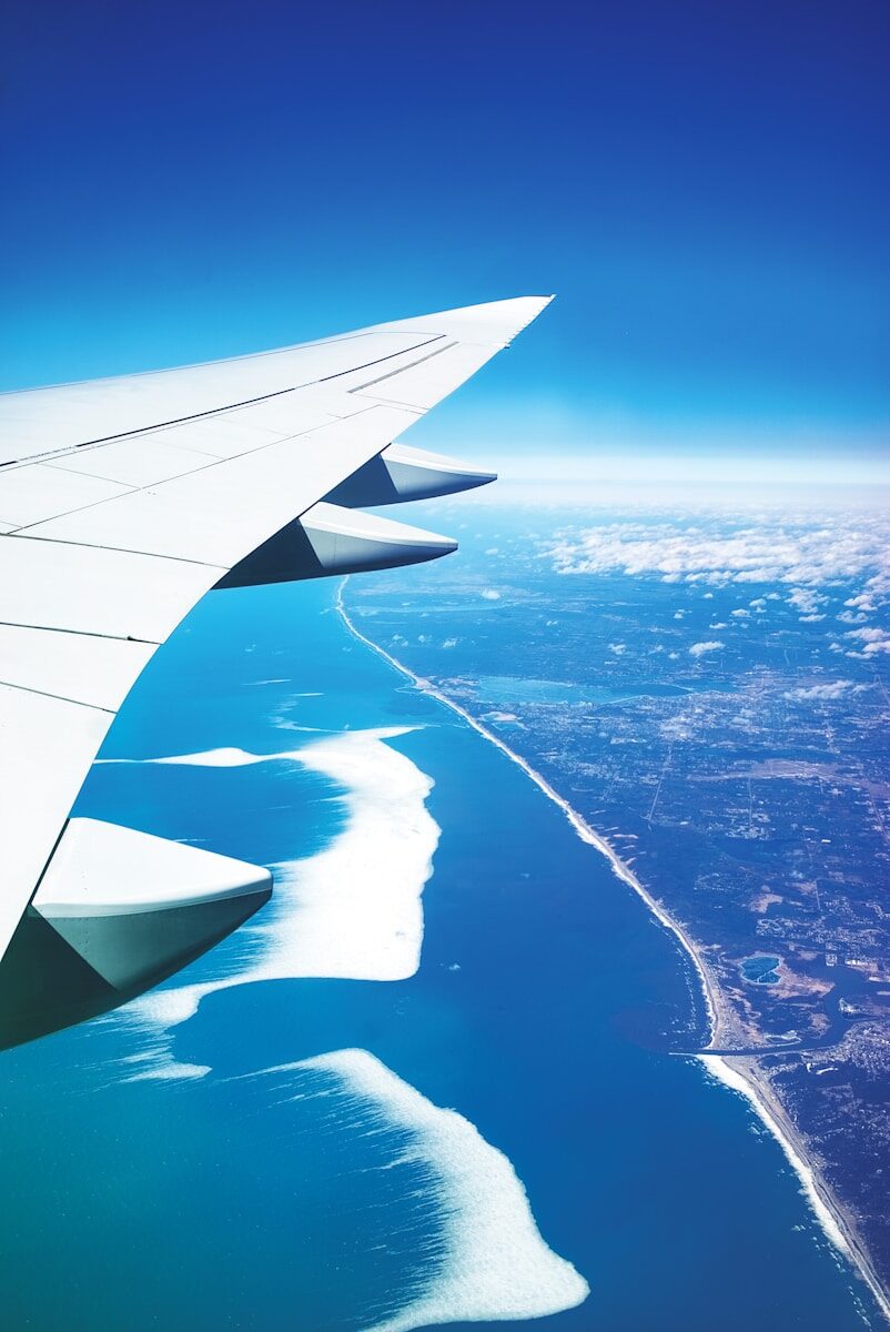 Passenger airplane in flight representing last minute flight options